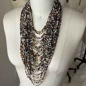 Multi layered bead necklace, never worn, excellent condition.